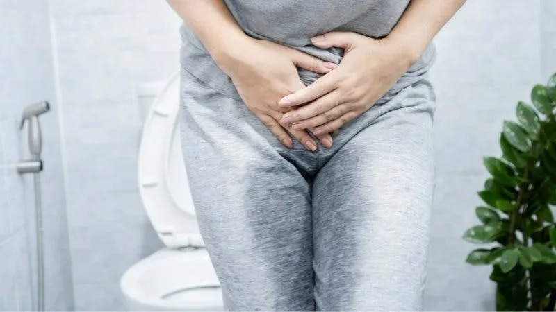 Woman experiencing bladder discomfort.